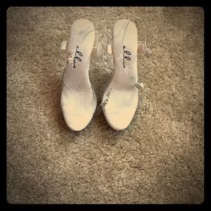 Ellie posing platform heels